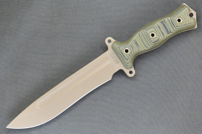 a large knife that is on a gray surface