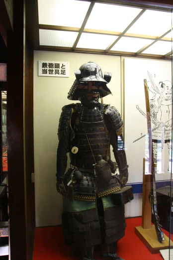 a statue is wearing armor and a hat