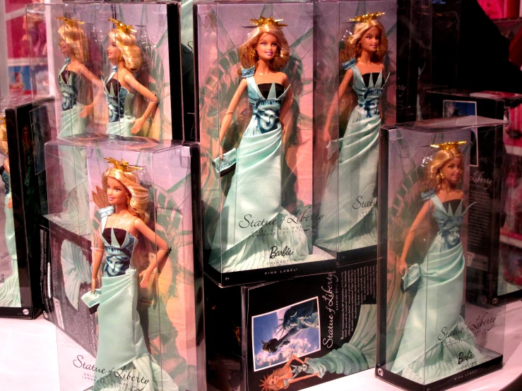 some barbie dolls are being displayed on display