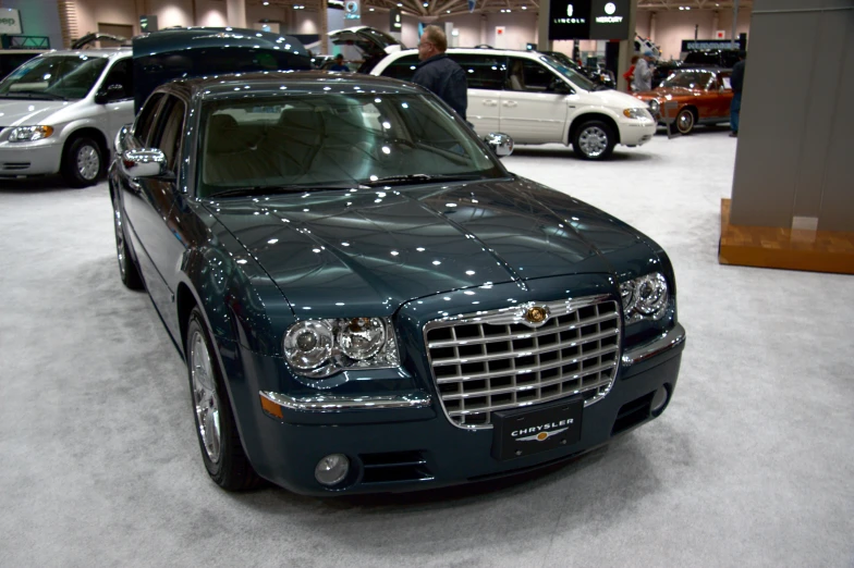 several cars parked in a building on display