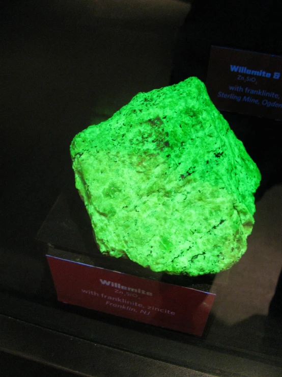 a green stone on display at a museum