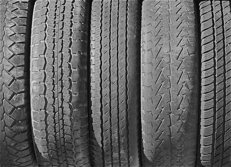 four tires lined up in order to be cleaned