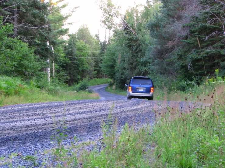 the truck is going on the side of the road