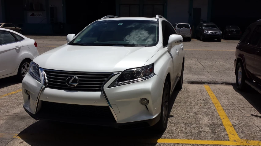 an exterior s of a white car in a parking lot