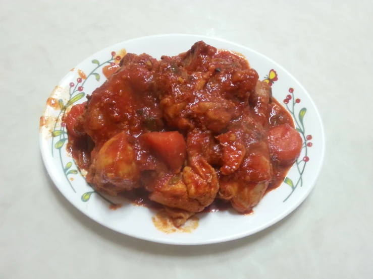 meatballs covered in sauce on a plate