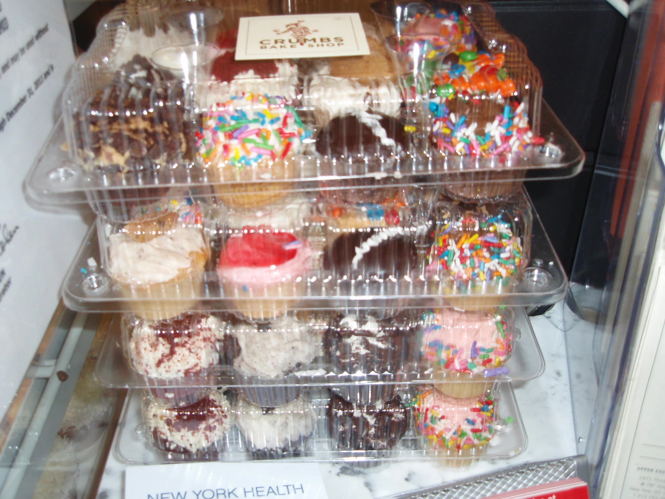 a rack filled with lots of delicious desserts