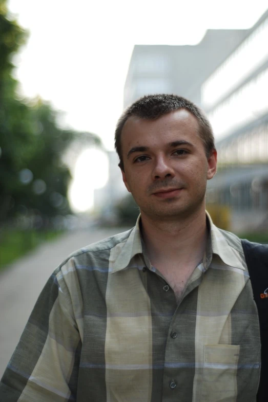 a close up of a person with a tie and a shirt