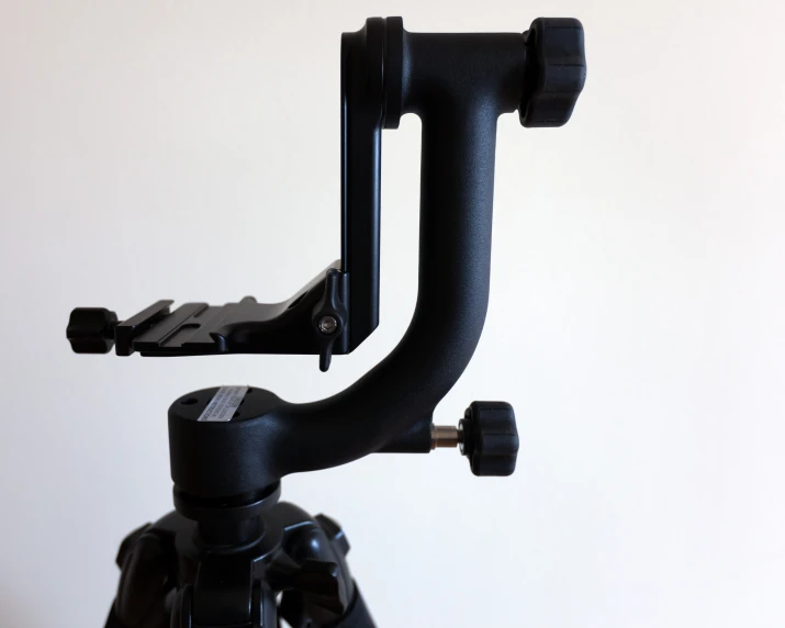 a tripod camera that is mounted on the wall