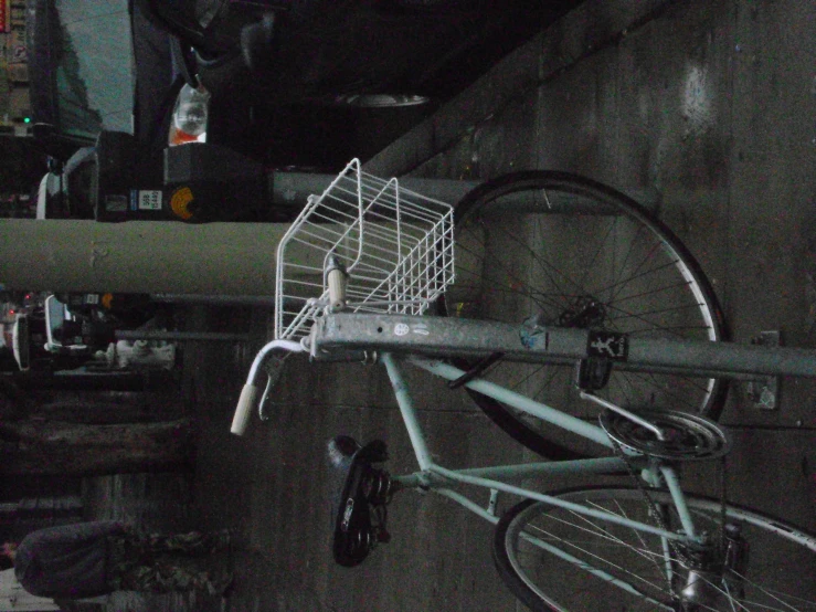 a bike is shown  to the metal railing