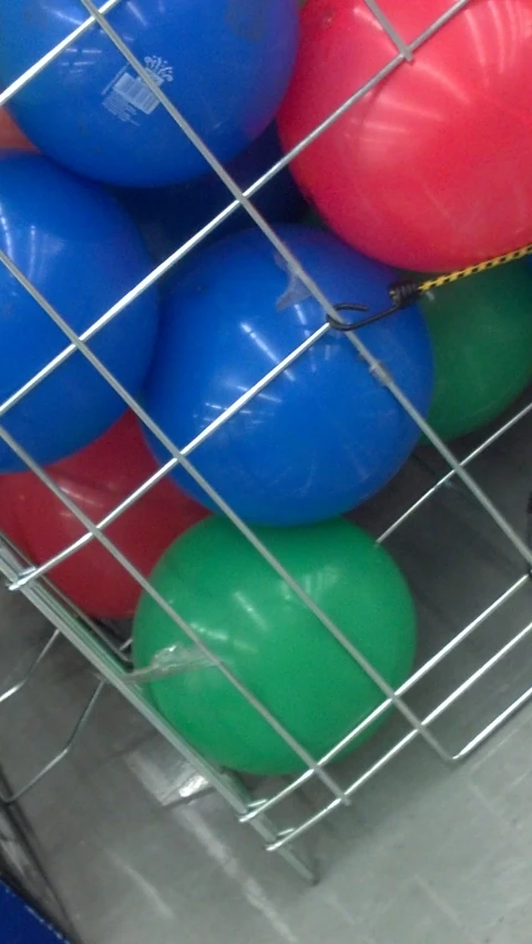 balls are in the cage of a store