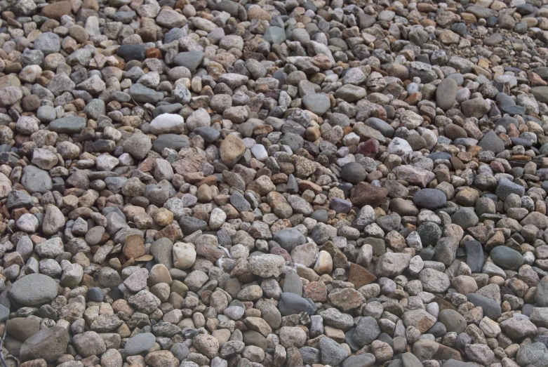 a stone surface that has gravel and rocks