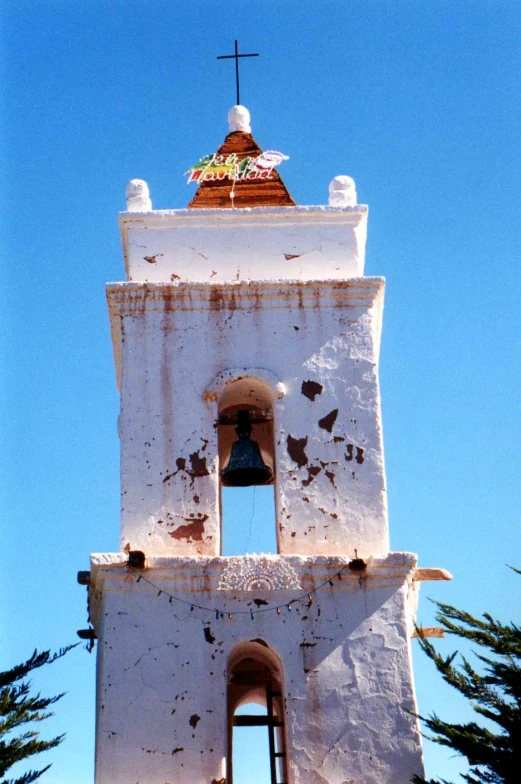 an old church bell tower with a sky background