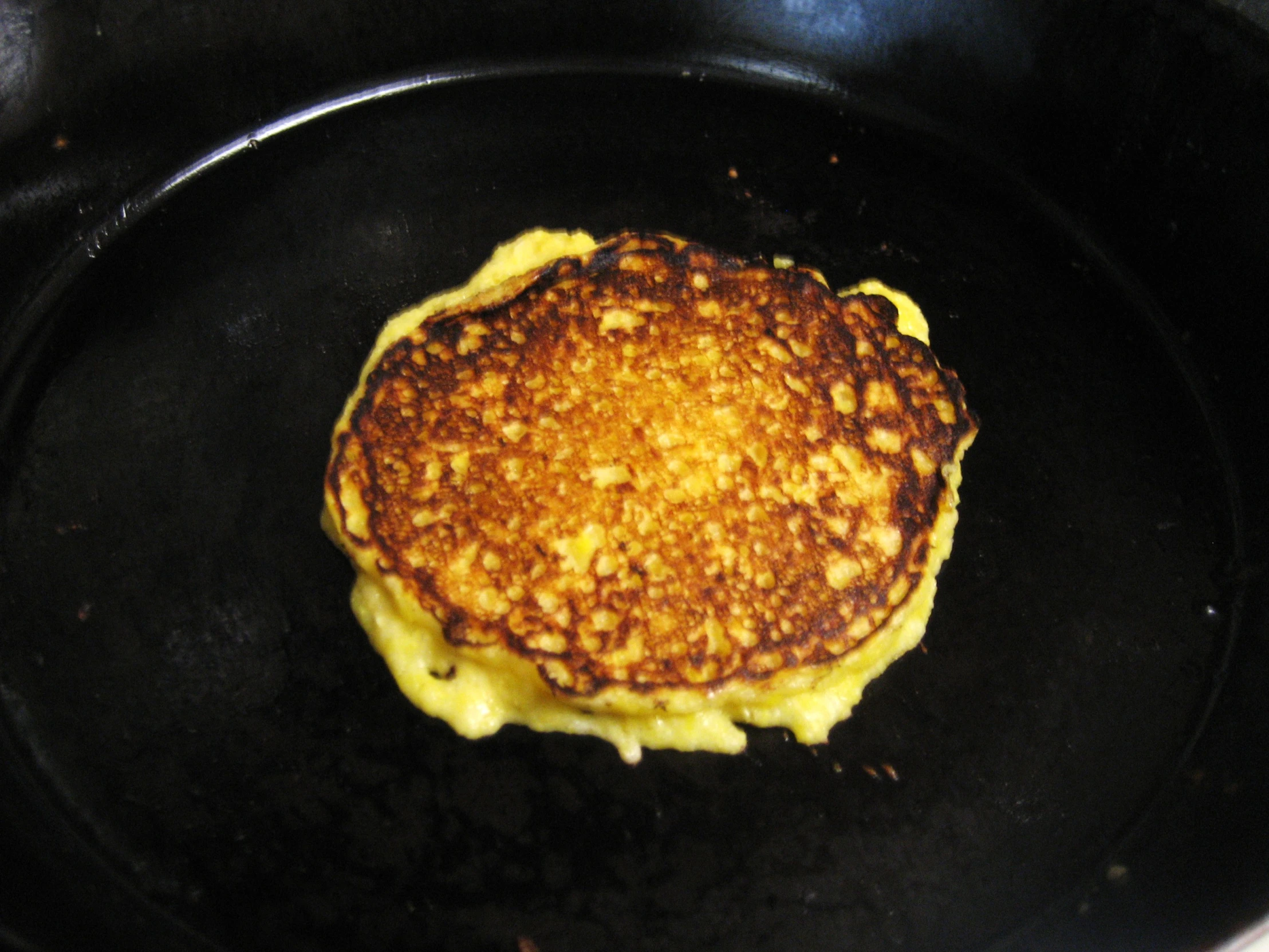 a close up of a plate of food with pancakes