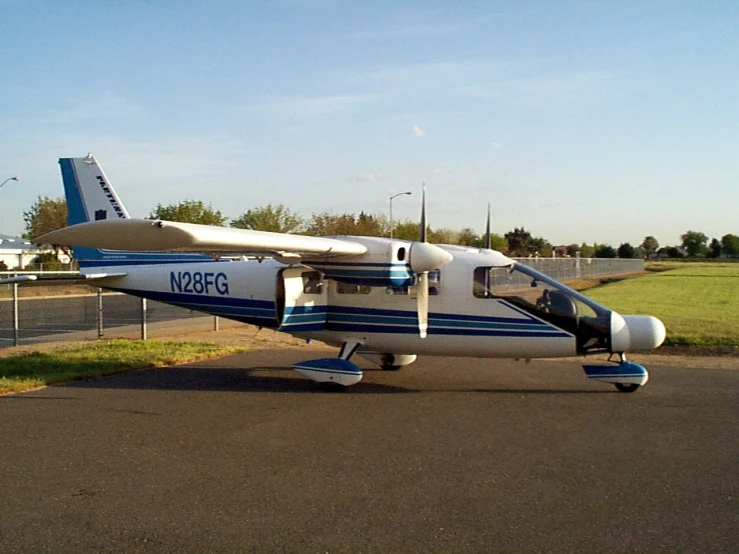 the small airplane is parked on the airport runway