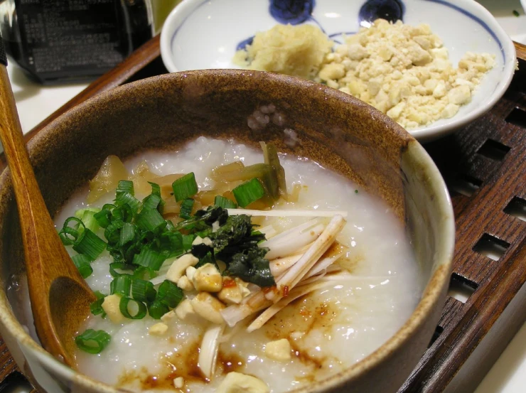 a bowl full of soup and other dishes