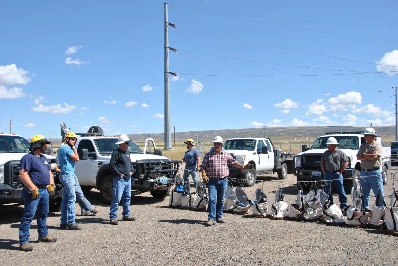 people standing next to trucks and guitars