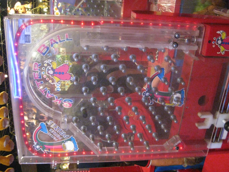 an old school arcade machine with many pins on the top
