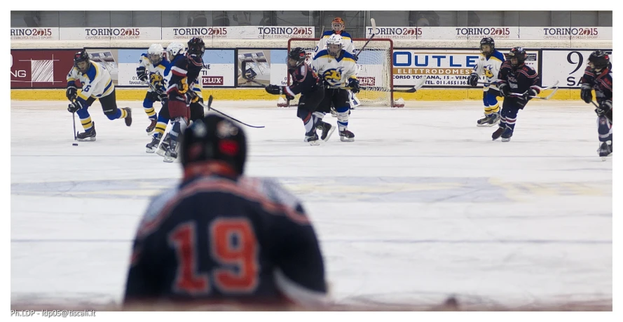 a hockey team playing on an ice rink