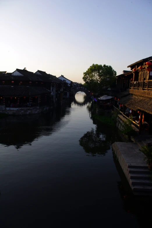 a small river flowing through an ancient town