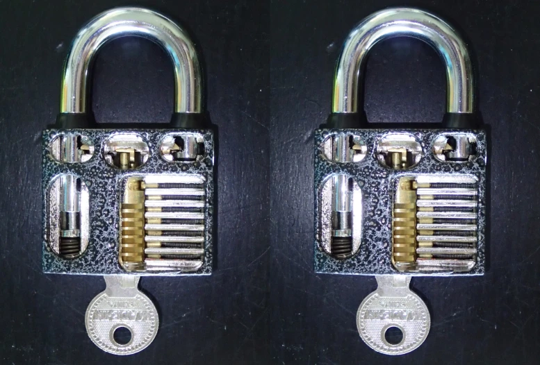 two locked combinations in silver sitting on top of each other