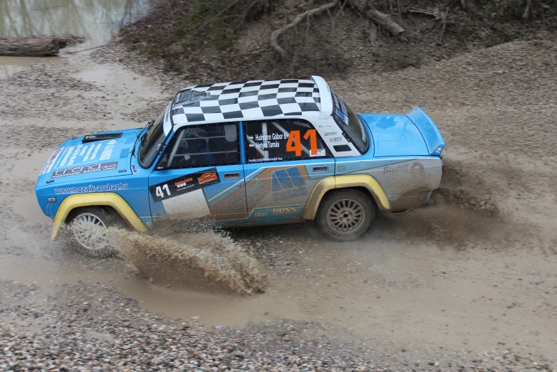 a race truck has stopped in the mud