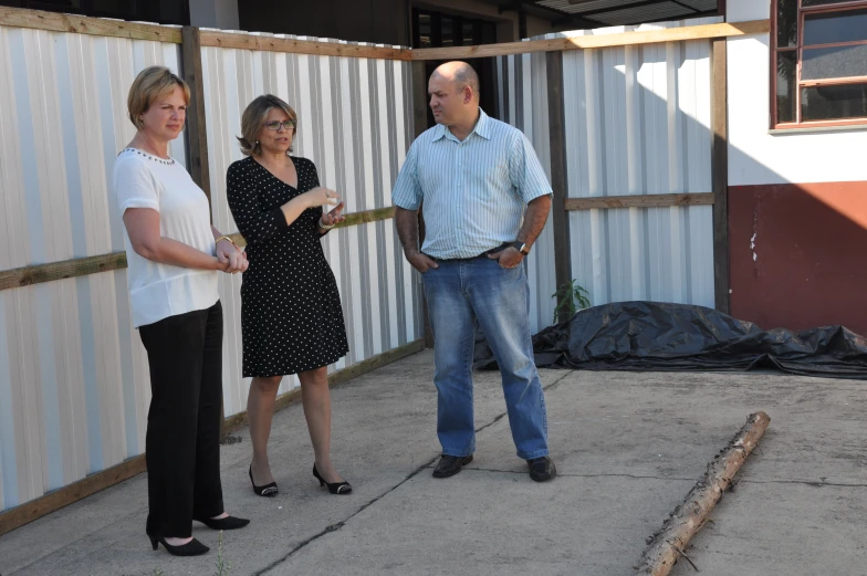 a couple of people standing in the porch