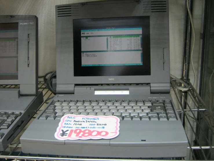 there is a laptop and a computer on display