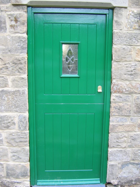 the front door is open, green with a small window