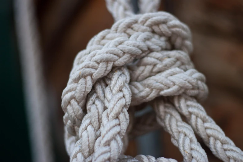 rope hanging outside a window of a wooden building