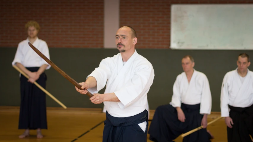 a man holding a sword during karate