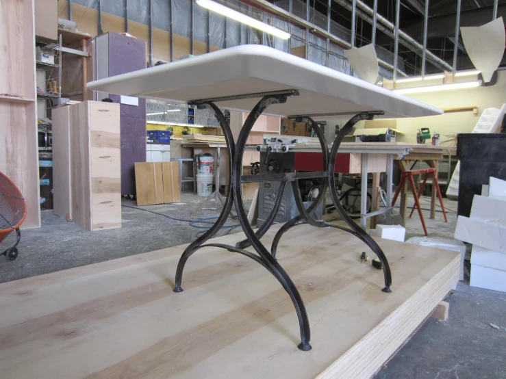 a table sitting on top of a hard wood table