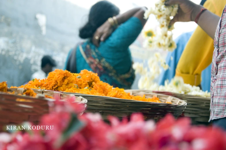 flower garlands arranged on baskets being served at festival