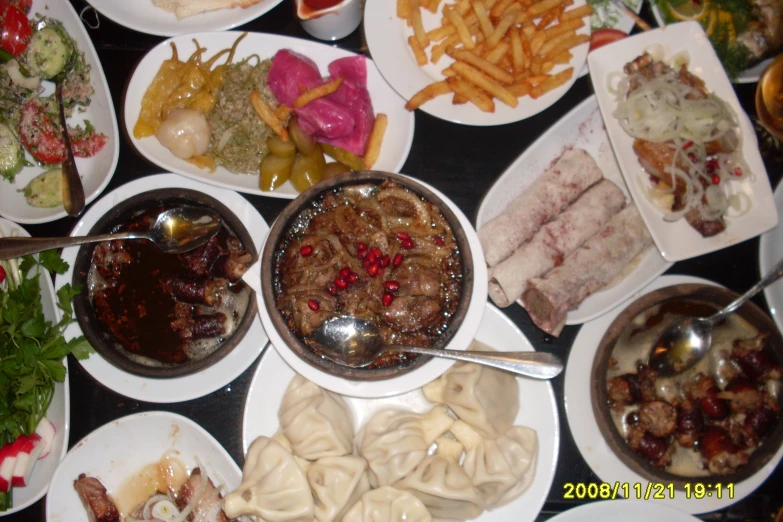 a group of plates with various food items on them