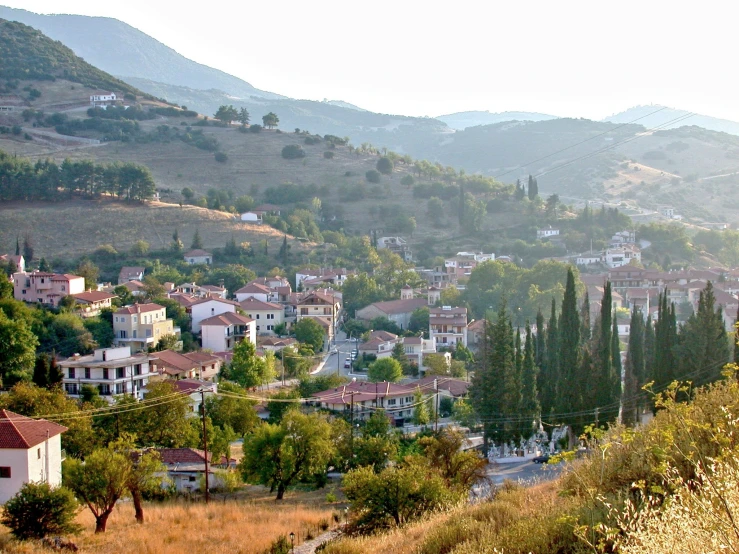 the hills surrounding a small village on a hill