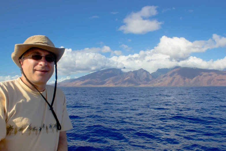 a man that is standing on a boat in the water