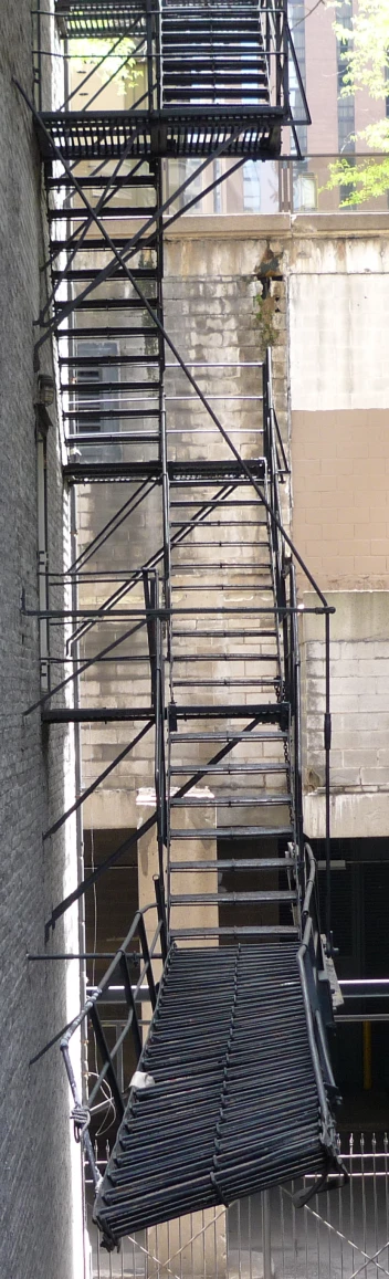 an aerial view of the stairwell next to a building