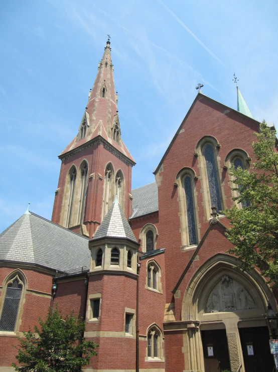 a building with three towers and a clock tower