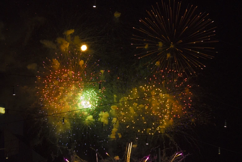 fireworks exploding in the night sky during festival