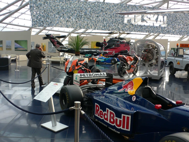 there are many different vehicles on display on the floor