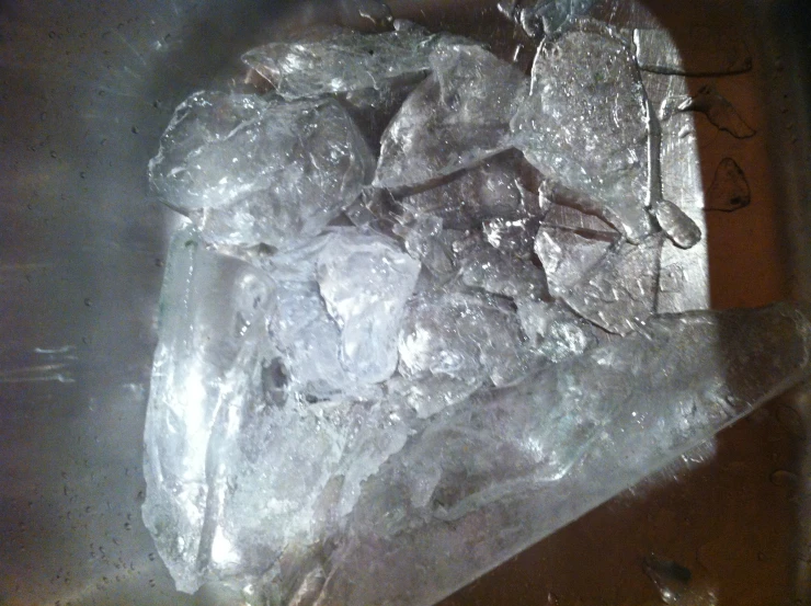 a bowl of ice with soing behind it