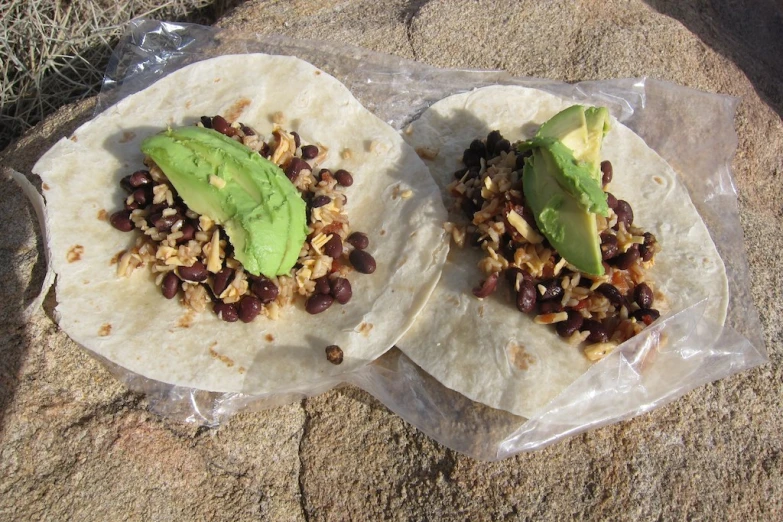 two black beans and avocado covered flatbreads