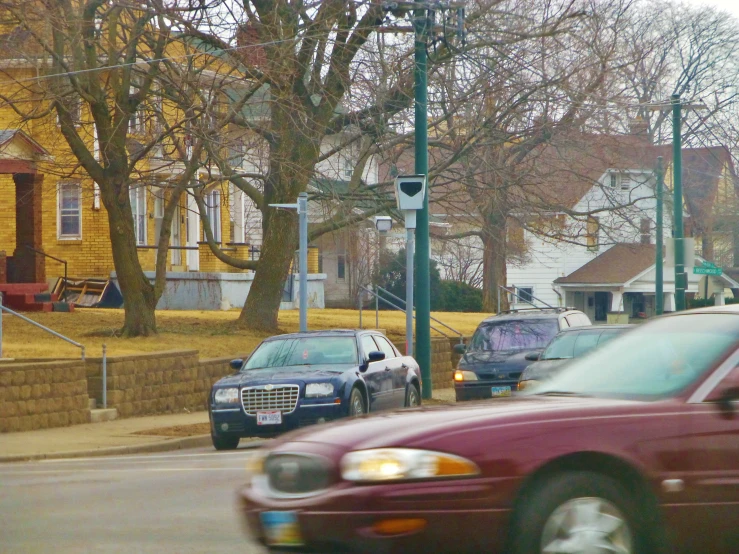 a city street lined with parked cars on both sides