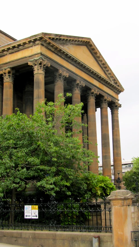 a large old building with pillars and many columns