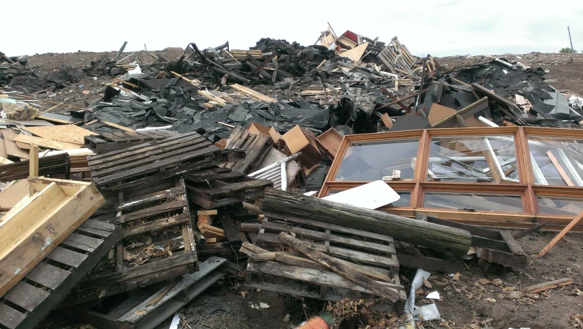 the piles of wooden and metal are piled together