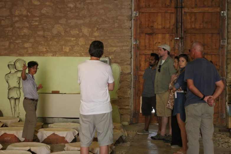 group of people in an old warehouse building