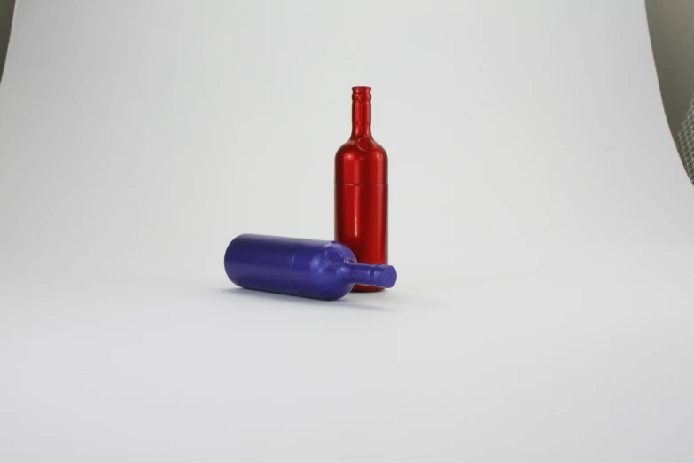 two empty wine bottles sitting on top of a table