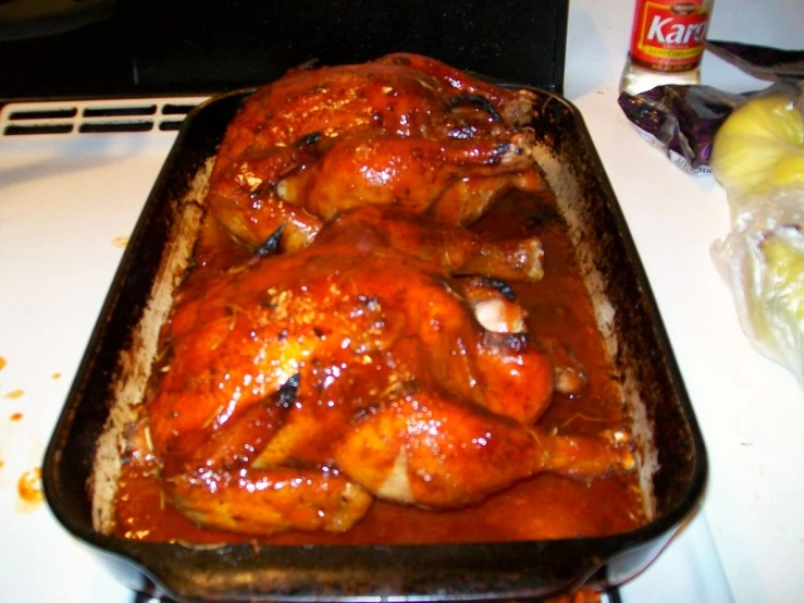 chicken dish being served in a baking pan