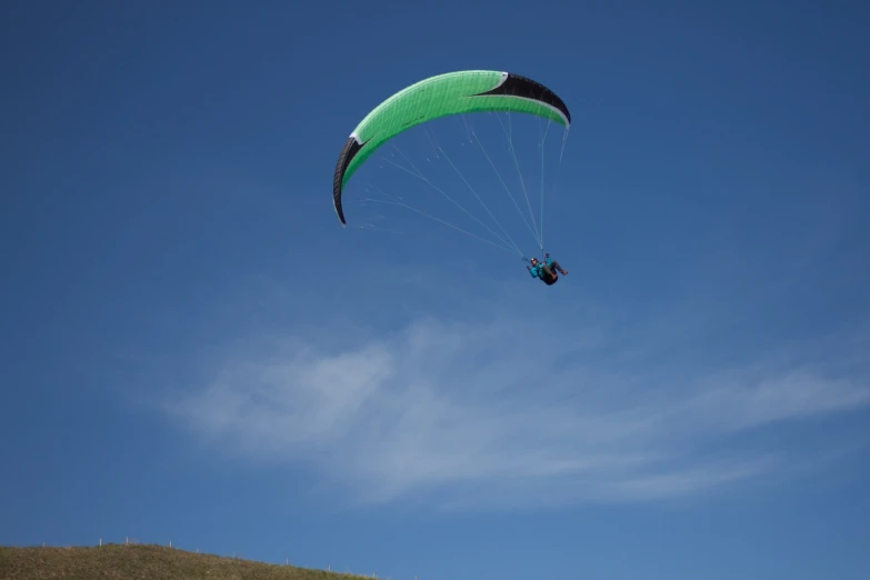 a person on the beach on a board parasailing