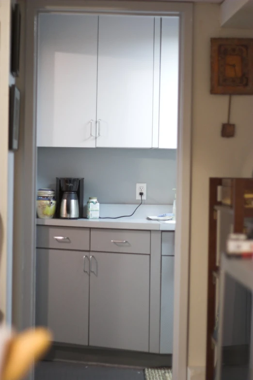 the kitchen area is narrow because the door on the door is closed