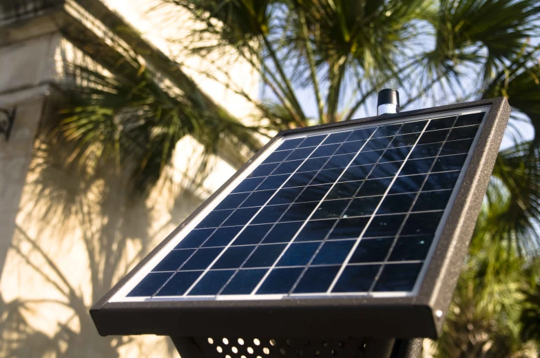 a small blue solar panel sitting on top of a building